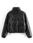 back view of puffer jacket made up of black leather hanging white wall