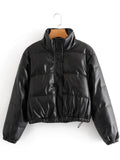 black puffer jacket hanging on brown hanger and white back ground